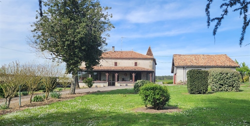 House with outbuilding in the countryside