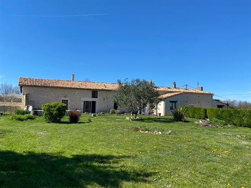 Attractive longère style property with a main house, rental property, pool and 2.7 hectares of land.