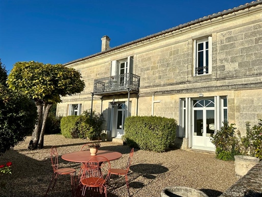 Just 30 minutes from Bordeaux, this newly renovated stone Girondine house is nestled in a magical ri