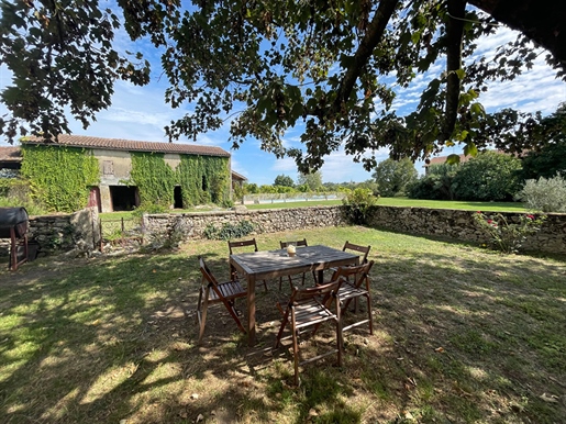 This traditional five bedroom farmhouse has comfortable reception spaces, great possibilities for de