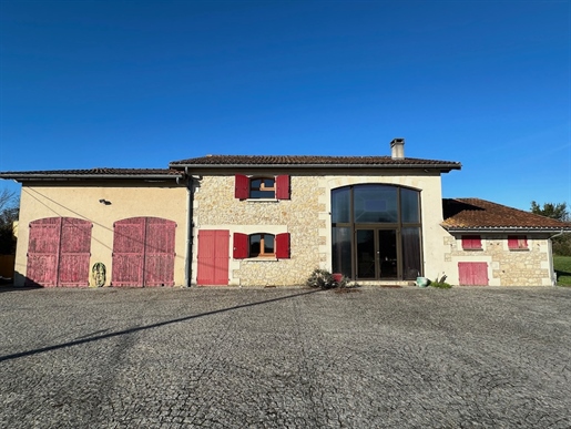 This renovated stone barn offers a professional commercial space including offices and a wine making