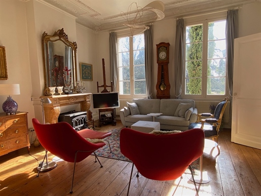 This elegant 1850s Maison de Maître, featuring three bedrooms and three bathrooms, is nestled in pic