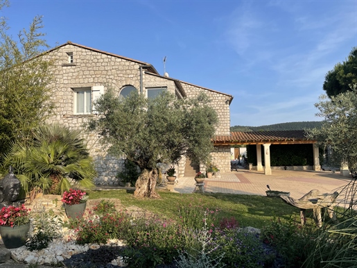 Superb stone property with swimming pool and outbuildings on enclosed and wooded land Lussas