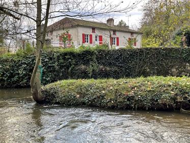 Renovated mill from 1780 with a living area of 298 m² on more than 5.5 hectares of land.