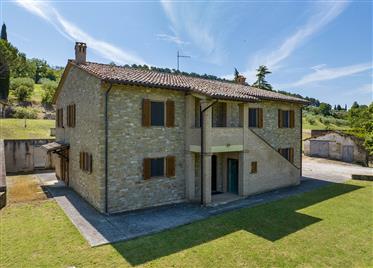Stone farmhouse with view of Assisi