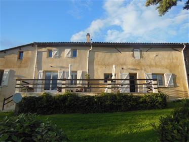 Former farm tastefully renovated, 241m² of living surface, main house with 2 bedrooms, guest house w