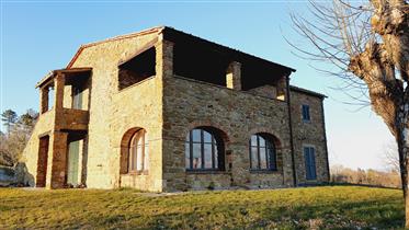 Tuscany, historic stone country house located in a panoramic position 