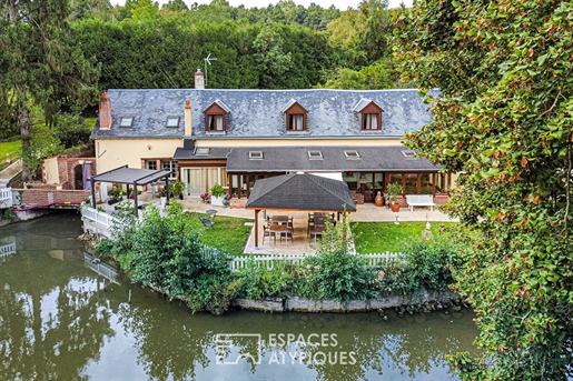 Charming renovated mill and its ponds in a green setting