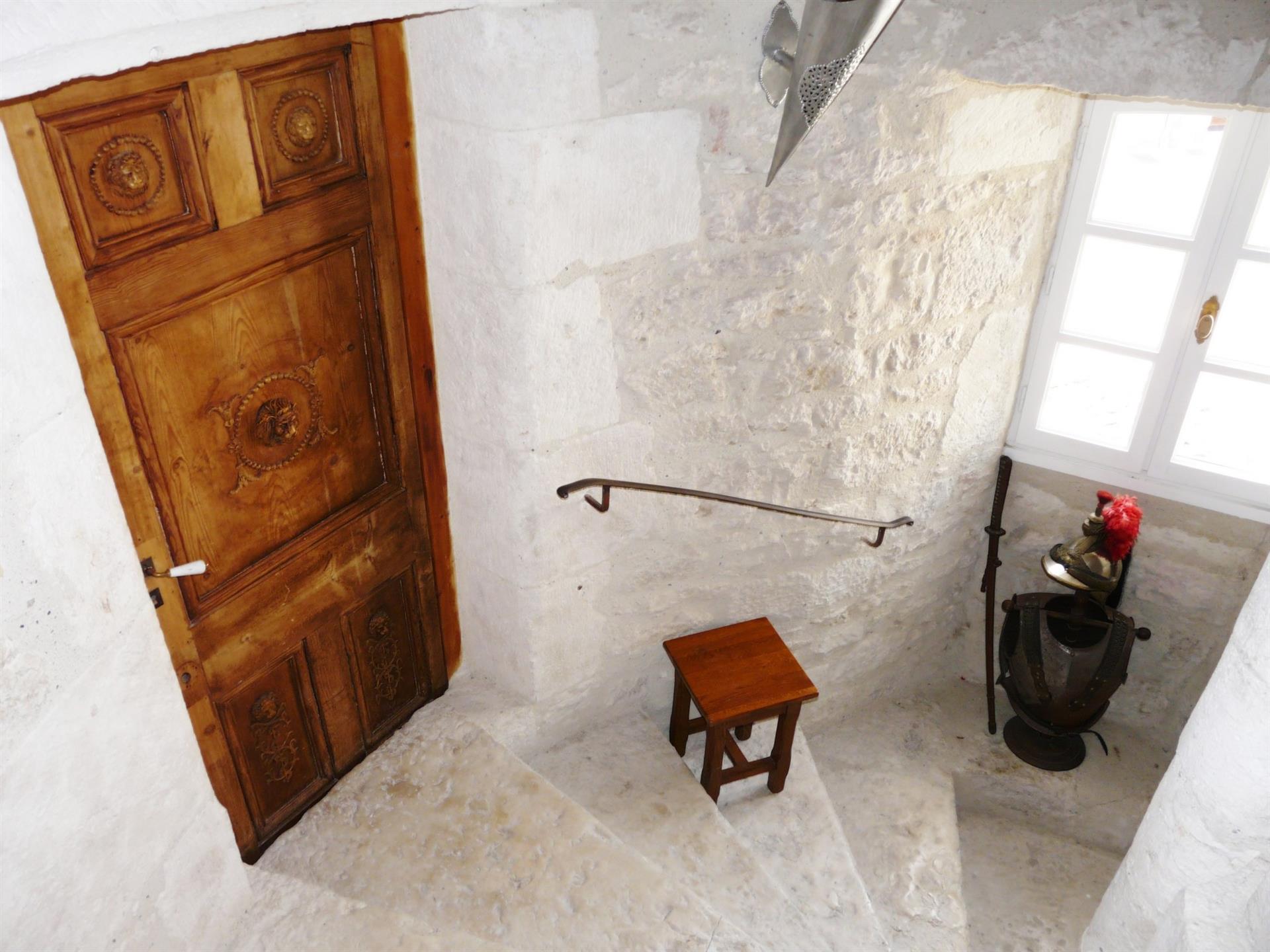 Residence of character dating from the fourteenth century located in the heart of a charming village