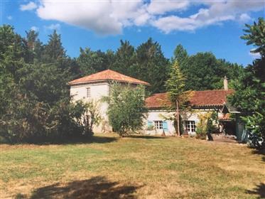 A stunning 19th Century farmhouse formerly part of the Le Claud vineyard estate, including a convert