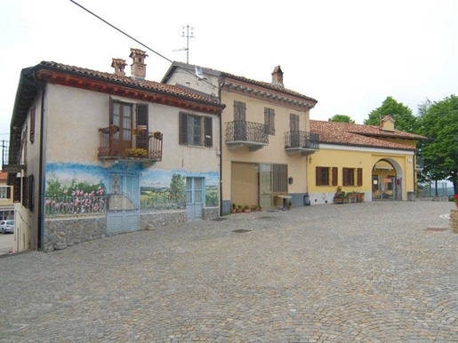 Overlooking the main square of Roddino, a large village house in need of restoration