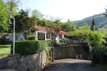 Superb detached house and gite in about 400 m sq of easily tended garden and sun terraces with a sma