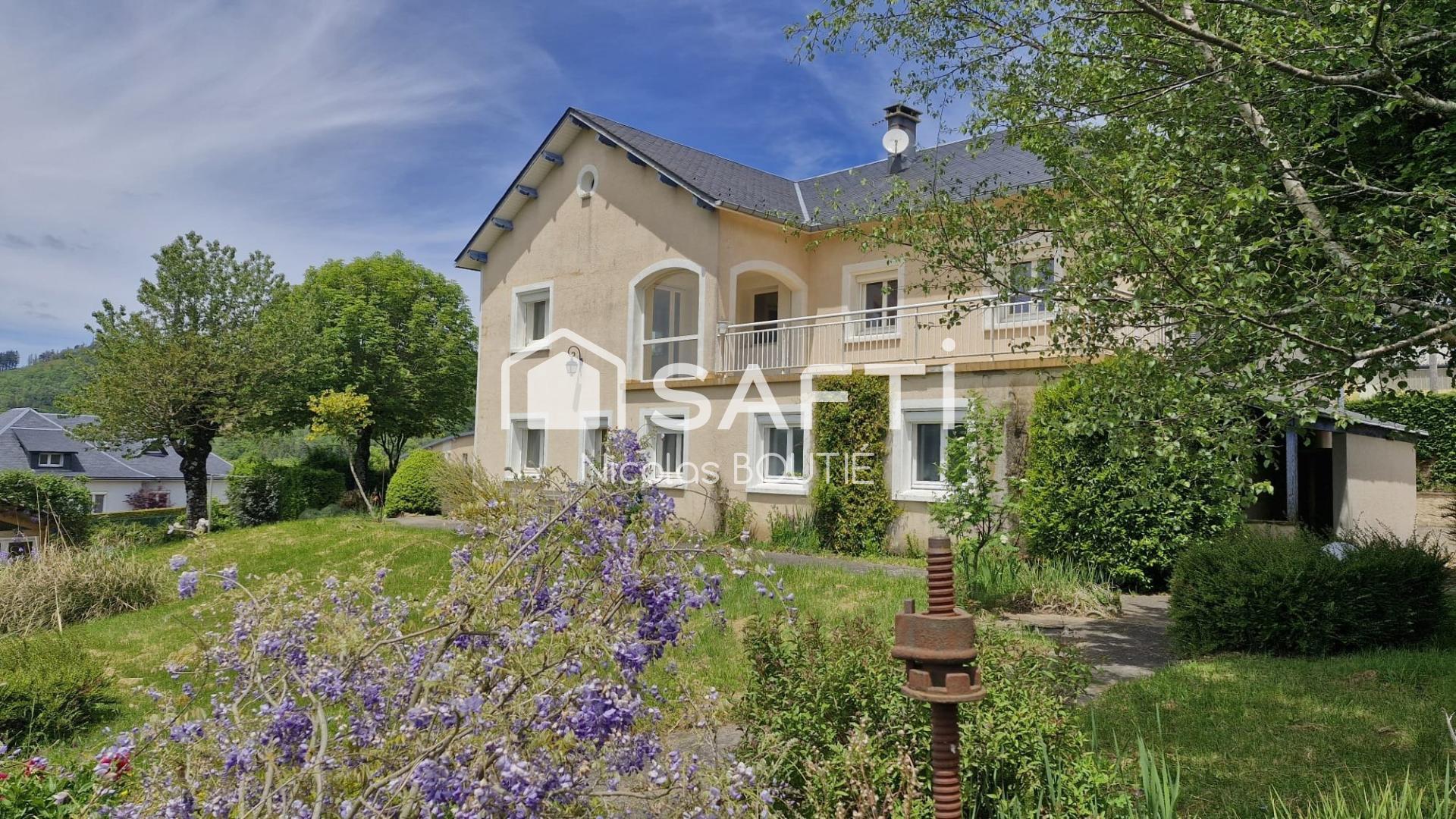 Residential house with garages and land