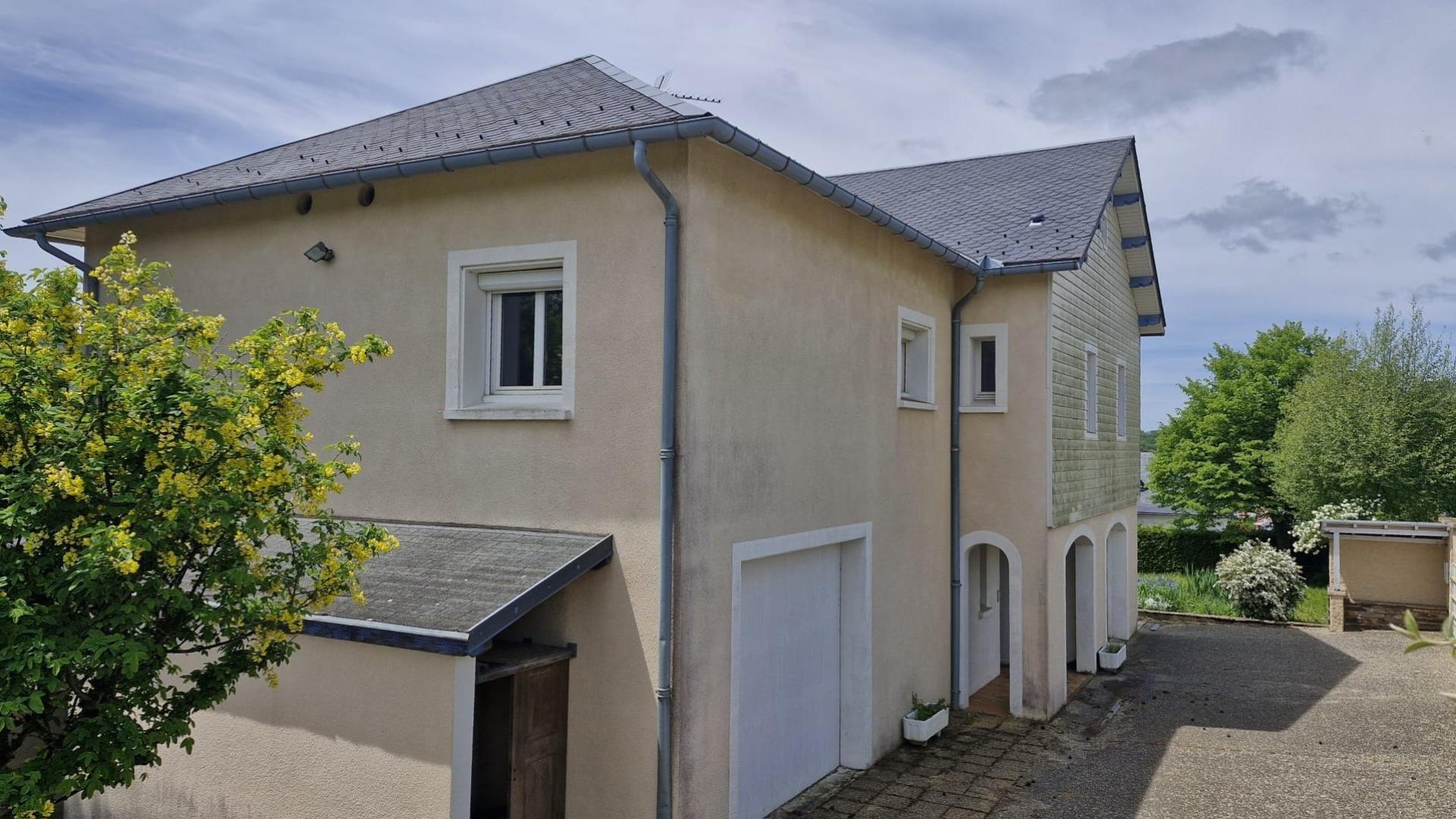 Residential house with garages and land