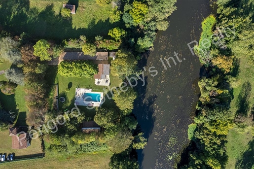 Property with multiple dwellings, pool, and river view