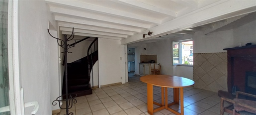 Huis 110 m² en garage.