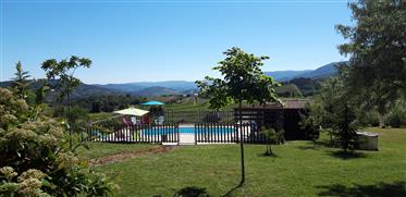 Beautiful property with house and 4 holiday homes, with pool and stunning view, on plot of 3602 m2