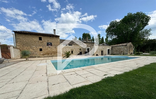 Old stone mill of 200M² with outbuildings on wooded property of 5565M² located in Montoison